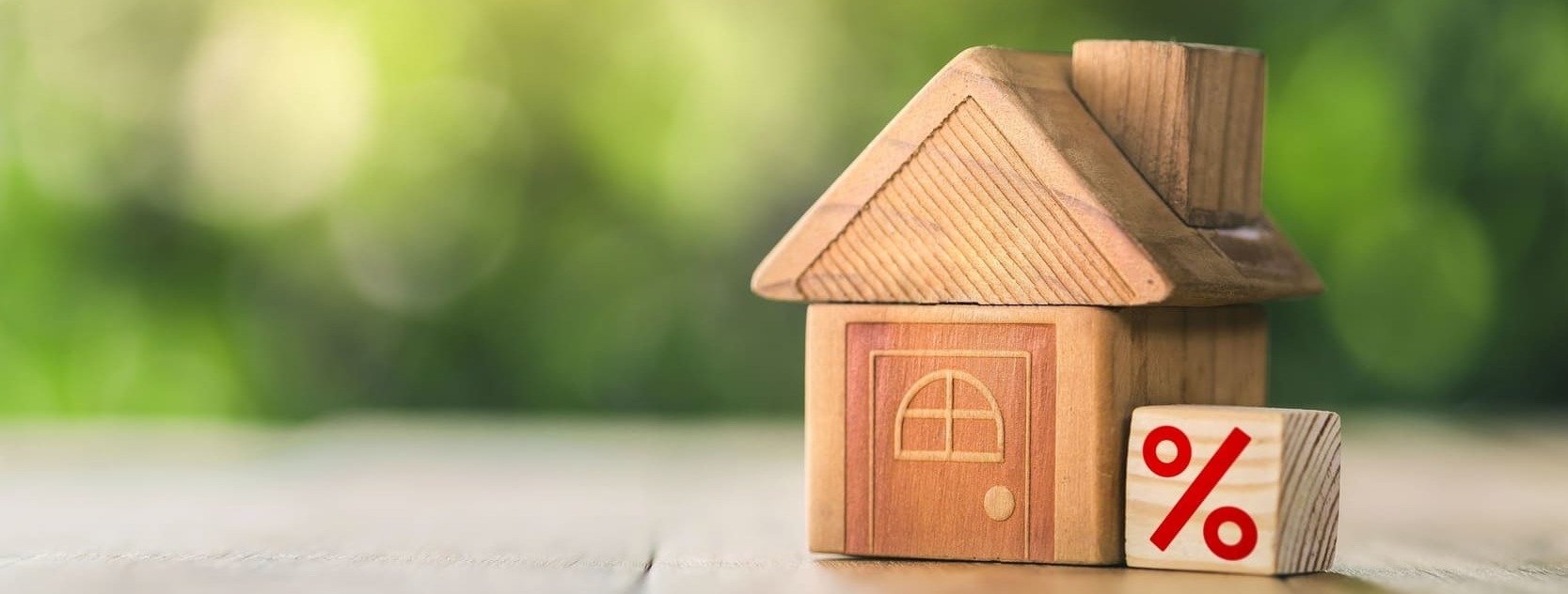 wooden house with percentage sign next to it